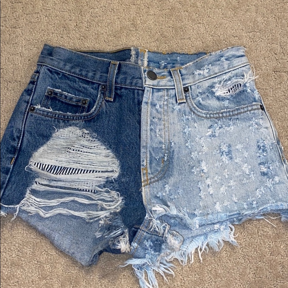 Two toned jean shorts with cute rip on right side!